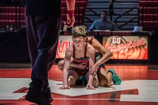 Courtesy of Shannon Biamonte##6th grader Dylan Walters prepares to make his way back to his feet. Walters is part of a thriving McMinnville Middle School wrestling program.