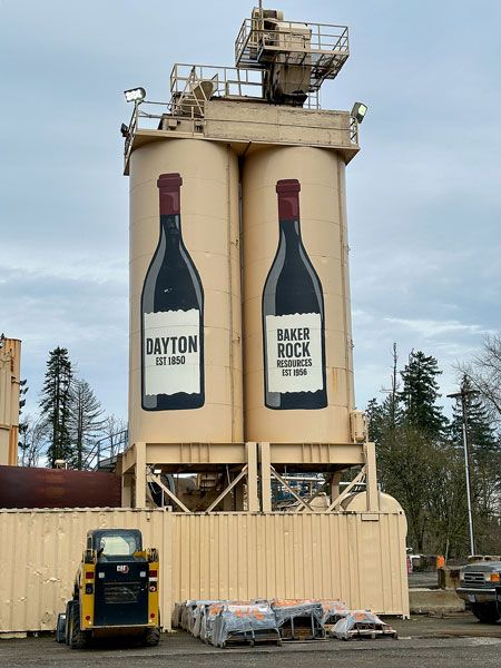 Kirby Neumann-Rea/News-Register##Dayton’s place in wine country is rock solid, as evidenced by the silo bottles just outside the city.