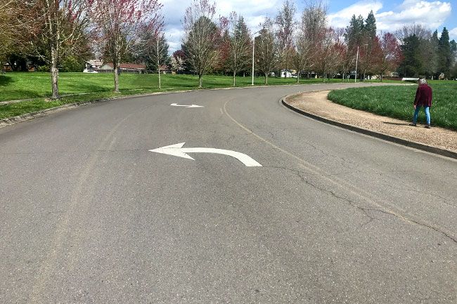 Kirby Neumann-Rea/News-Register##Arrows seem to point to nowhere on Keck Drive between Albertsons and the Linfield campus.