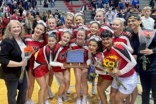 Courtesy of Tracy Brandt##McMinnville’s cheer team won its third championship, and second in a row, by edging Tualatin on the judges’ scorecards. Mac also earned fifth place at nationals.