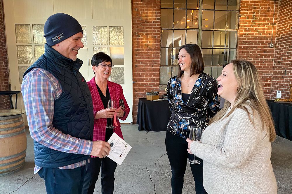 Starla Pointer/News-Register## Kim Morris (red coat) with husband Mike were named the McMinnville Downtown Association Volunteers of the Year in February. Kim went on to win the mayor s race in the November general election.