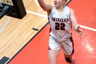 Rusty Rae/News-Register##McMinnville junior Macie Arzner chipped in 11 points in the team’s second win over Forest Grove.