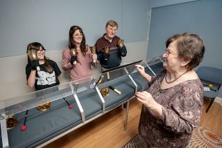 Rachel Thompson/News-Register##Handbell ringers Andrea Dennis, left, Michelle Dennis, John Cramer and Nan Cramer practice music for the new McMinnville community handbell choir. More ringers are needed to join the group, which will perform at a variety of venues.