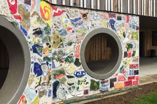 Kirby Neumann-Rea/News-Register##Sunflower, elk, blue moon, blackbird, images on mural from before it became the tribal cultural center.