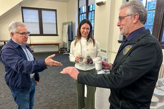 Kirby Neumann-Rea/News Register##Rep. Lucetta Elmer talks before her presentation Tuesday with Stan Primozich, left, a former Yamhill County Commissioner, and District Attorney Brad Berry, in Jonasson Hall at Linfield University