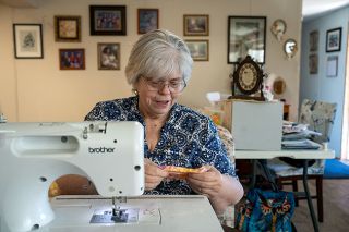 Rachel Thompson/News-Register##Dorothy Lambe works at her sewing machine, an activity she has enjoyed since she was a girl. The retired special education teacher is opening a sewing school because she wants other young people — and adults — to learn the skills.