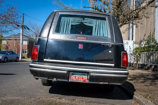 Rachel Thompson/News-Register##Seen on Northeast Davis Street in McMinnville, a hearse with a license plate pun.