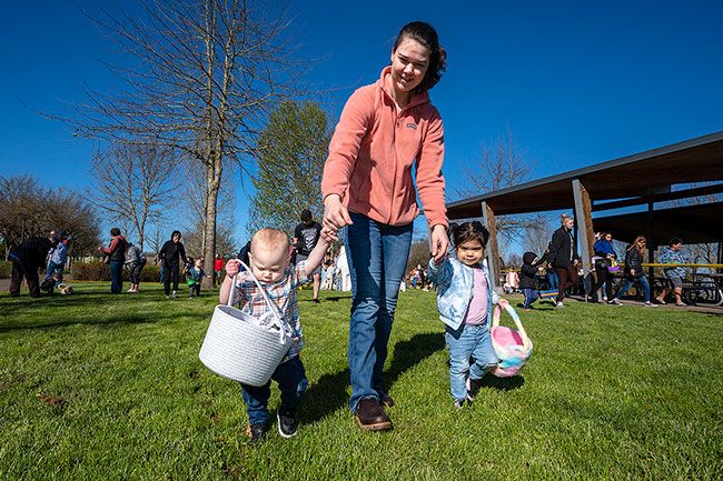 Rachel Thompson/News-Register## Shelby Thurman, center, with Kyler Turner, 1½, at left and Amalia Thurman, 2½, right, hoping to fill their baskets with plastic eggs. The Lafayette residents were among hundreds who turned out on a beautiful spring Saturday for the Lions’ Easter tradition.