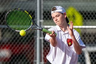 Rusty Rae/News-Register##McMinnville’s Hollis Teller won his matchup against Liberty’s Anthony Ho in straight sets.
