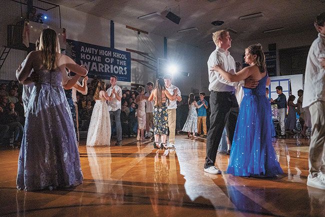 Rachel Thompson/News-Register##Seniors waltz to “A Waltz for a Gentle Night” under the direction of wood shop teacher Savannah Stanton, in the high school gymnasium. The waltz has been a part of May Day as far back as school records show.