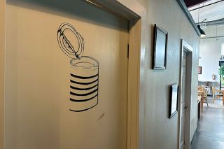 Kirby Neumann-Rea/News-Register##Alpine Kitchen owners kept the men’s room “can” symbol when it was renovated after closure of Valley Commissary four years ago.