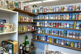 Kirby Neumann-Rea/News-Register##Cans once holding domestic and foreign beers line shelves on the second floor of Lafayette Schoolhouse Antique Mall.