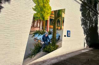 Kirby Neumann-Rea/News-Register##Rose Marie Caughran’s mural was painted in three sections indoors in 2022, and then moved to Cowls Street for installation.