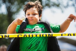 Rachel Thompson/News-Register##Amity 9-year-old Roman Olea crosses the finish line, winning first place in the egg-on-a-spoon race at the Amity Day games in City Park on Saturday. Two more races followed, and Mayor Rachel King passed out extra hard-boiled eggs to the crowd afterward. Amity Day events returned after a few-year hiatus. King said, “You never know how a first time is going to turn out. I’m so pleasantly surprised.” Sabine Buchanan, who helped out at the Amity Fire Auxiliary booth, said bringing back Amity’s summer celebration “makes a lot of people really happy. I’m one of them.”