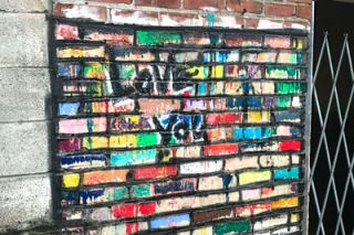 Kirby Neumann-Rea/News-Register##The historically bedraggled narrow passageway between Davis and Evans streets has been home to unauthorized artwork in the past, such as the bright highlighting of this brick section.