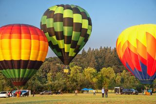 Rachel Thompson/News-Register##Hot air balloons lift off at dawn to kickoff the annual Rock of Ages/Valley View Fun Festival Saturday. Another balloon offered tethered rides a little later in the morning, and the fun continued all day with children&rsquo;s activities, radio-controlled aircraft, food and music, including Second Winds, gospel singers and a barbershop quartet.