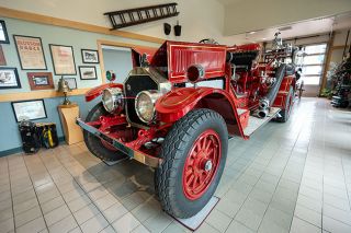 Rachel Thompson/News-Register##Engine 1 is surrounded by equipment, photos and other memorabilia at McMinnville fire hall. The museum will be on full view during Sunday’s 150th anniversary open house.