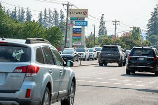 Rachel Thompson/News-Register##Rush hour traffic, such as this congestion on Highway 99W on Wednesday afternoon, is an urban-area symptom yet is a reality in McMinnville, still a “rural” community in the eyes of many funding sources. The next census could shift McMinnville to urban status, though it still faces other obstacles typical of rural communities.