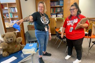 Starla Pointer/News-Register##Marie Palacios, right, discusses her classroom setup with Robin McKinney, special programs assistant at Newby Elementary School. Palacios has been an assistant for seven years, but this year will be the special programs teacher.