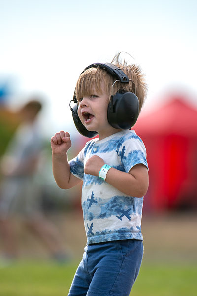 Rachel Thompson/News-Register##Sal Wilkerson, age 2 1/2 of Portland cheers for the airplanes Sunday at Evergreen Aviation Museum. The facility hosts the annual watch party from across Highway 18 from the airport.