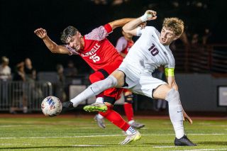 Rachel Thompson/News-Register##McMinnville senior Adan Figueroa Lampke battles with Franklin junior Milo Gunderson on Tuesday night.