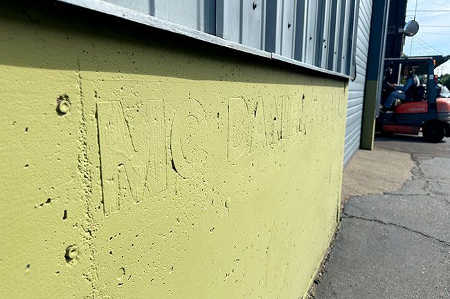 Kirby Neumann-Rea/News-Register##Historic McDaniel Seed Co. imprint remains visible on R. Stuart & Co. building on Northeast Fifth Street.