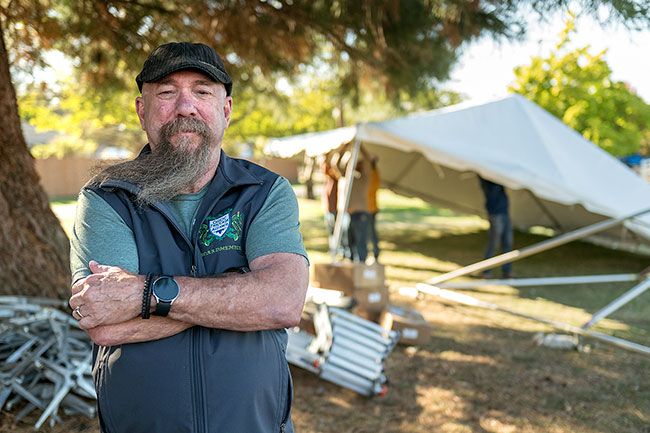 Rusty Rae/News-Register##Joe Bailey takes a break from setting up tents for the annual McMinnville Scottish Festival, which will be held Saturday and Sunday, Oct. 5 and 6, on the Yamhill County Fairgrounds. Bailey runs the beer booth during the event, but spends a whole week helping with set up and take down.