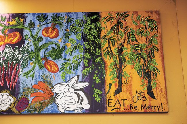 Rusty Rae/News-Register##Rabbits are depicted on the walls and shelves of Harvest Fresh. Sanford chose the bunny mascot when the store moved downtown, inspired by the real rabbits that showed up regularly at the old location on Highway 99W.