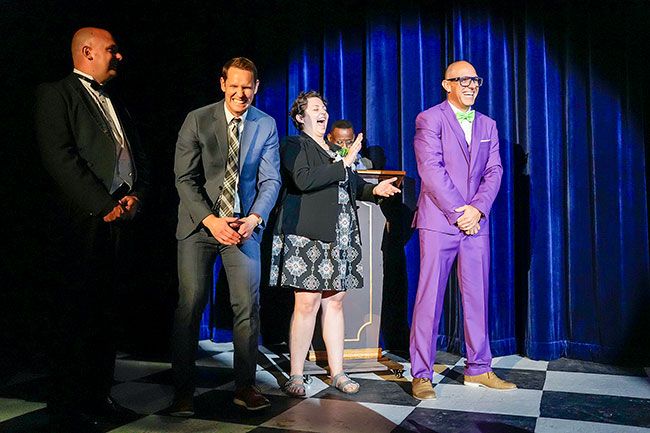 Rachel Thompson/News-Register##Contestants enjoyed getting to know each other during “Crown.” Sharing a laugh during “evening wear” competition are John Olson, left, Tim Love, Caitlin Nemeth and Beto Reyes. Behind them is emcee Larry Miller.