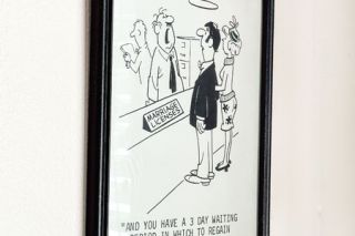Kirby Neumann-Rea/News-Register##A framed cartoon offers a dose of dour humor for people filing for marriage licenses at the Yamhill County Clerk’s Office.