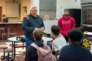 Tanner Russ/News-Register##New Dayton baseball coach Reed Rainey addresses the student athletes at his introduction to the community.