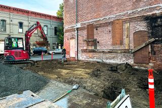 Kirby Neumann-Rea/News-Register## Construction crews begin site preparations at Second and Cowls streets for two new family dwelling units. Andrew Wilder is building the project at 218 N.E. Cowls St.