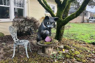 Racheal Winter/News-Register##A wide-eyed cat figure on 12th Street is just one of two coyly posed felines visible around McMinnville. There may be 
others.