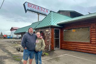 Kirby Neumann-Rea/News-Register##Chris DePrimo and Danielle Vollman stand in front of the revived Bonanza Bar & Restaurant in Grand Ronde. The Willamina couple is hoping to open the business by Dec. 15.