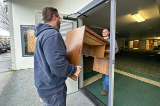 Rachel Thompson/News-Register##Bringing supplies and furniture through the Fourth Street entrance of Provoking Hope&rsquo;s new location Monday morning are Lucas Bonilla, left, Certified Recovery Mentor and intake assistant, and Matthew Appello, Responsible Dads Facilitator. &ldquo;I&rsquo;m excited for it. A lot of possibilities for the building,&rdquo; Appello said.