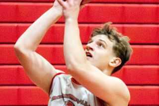 Logan Clark/News-Register##Mac coach Tucker Coil said the team will lean on varsity returners Dylan Ferrua, pictured here going up for a shot at practice Tuesday, and Brayden Mix to lead the Grizzlies this season.