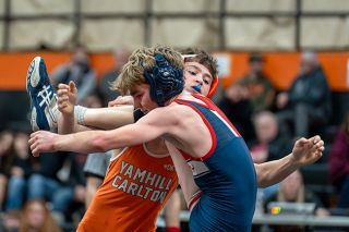 Rachel Thompson/News-Register##Joseph Petraitis looks for a take-down in his 106 match during a 3 way duel on Dec. 27 at the Tiger Dome. The next day, Petraitis took second at the Hall of Fame Tournament in Sheridan.