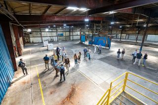 Rachel Thompson/News-Register file photo##Development firms tour the inside of the main building of the former Ultimate RB property in August 2024. The city selected three applicants and their conceptual plans, and is expected to select one next month.