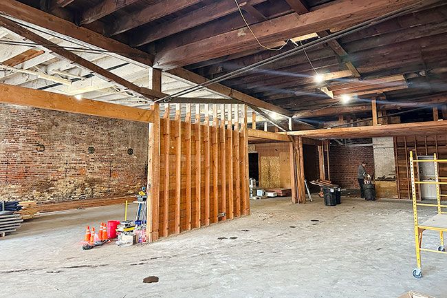 Kirby Neumann-Rea/News-Register##CARRIAGE HOUSE: Dave Queener, owner of Two Dogs Taphouse, cleans up after initial demolition on what will be Carriage House, a future cafe and event venue  in the 500 block of Fourth Street. The space was formerly rented as storage by Yamhill County. The cafe will be a new adjunct to the tap house adjacent on Northeast Evans and could be open as early as mid-year. Carriage House is named for its 19th-century roots as a garage for horse-drawn carriages; Queener is leasing from the connected Celestial Hill winery tasting room, currently doing renovations on Third Street