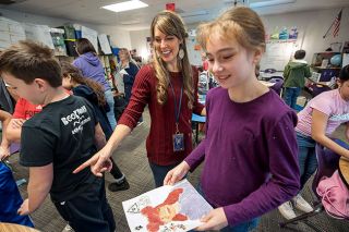Rachel Thompson/News-Register##At Grandhaven Elementary, McMinnville School District artist-in-residence Jessica Campbell talks with fifth-grader Halie Hoffman about her self-portrait. In Campbell s visits to every fourth- and fifth-grade classroom in the district this year, young artists are learning about self-expression as well as creative steps such as mixing colors. Rachel Thompson/News-Register##At Grandhaven Elementary, McMinnville School District artist-in-residence Jessica Campbell talks with fifth-grader Halie Hoffman about her self-portrait. In Campbell s visits to every fourth- and fifth-grade classroom in the district this year, young artists are learning about self-expression as well as creative steps such as mixing colors.