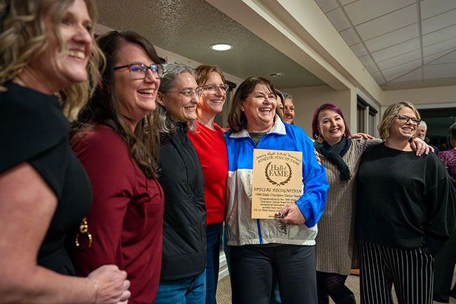 Rachel Thompson/News-Register##Members of the 1996 state champion Amity dance team pose with a plaque of special recognition given by the Amity Hall of Fame committee.