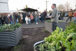 Rusty Rae/News-Register##Brian Altree, McMinnville High School horticulture teacher, tells visitors to the Giving Gardens Celebration about the culinary items tended by students. Altree said the teens take ownership of the project as they work in the garden daily. Rusty Rae/News-Register##Brian Altree, McMinnville High School horticulture teacher, tells visitors to the Giving Gardens Celebration about the culinary items tended by students. Altree said the teens take ownership of the project as they work in the garden daily.