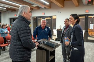 Rusty Rae/News-Register##Oregon State Rep. Lucetta Elmer, R-McMinnville, talks with George Siegfried, left, Mark Shepard, center and Carlton Police Chief Kevin Martinez following a community forum in Carlton Wednesday night. Residents asked her about upcoming bills, her work on the ethics committee and her efforts to promote public-private partnerships.