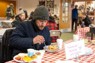 Rusty Rae/News-Register##Grant Leblanc dives into breakfast at the First Baptist Church Monday morning. The church serves breakfast from 9 to 10 a.m. With the opening of the nearby navigation center, there has been a spike in the number of people arriving for the morning meal. Rusty Rae/News-Register##Grant Leblanc dives into breakfast at the First Baptist Church Monday morning. The church serves breakfast from 9 to 10 a.m. With the opening of the nearby navigation center, there has been a spike in the number of people arriving for the morning meal.
