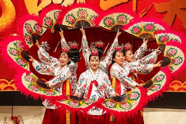 Rachel Thompson/News-Register##Dancers from Oregon Korean Performing Arts perform the traditional Korean buchaechum, or fan dance, during the third-annual Lunar New Year Celebration on Sunday at the McMinnville Community Center. The festivities, hosted by the Asian Heritage Association, welcomed the Year of the Snake.