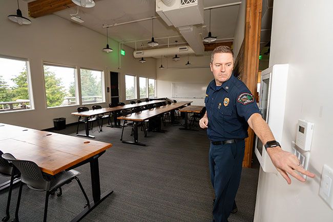 Rachel Thompson/News-Register##McMinnville Fire District added a new facility in late 2024 at 3850 S.E. Three Mile Lane in southeast McMinnville, and move-in is underway. Assistant Chief Ty Darby turns on the lights in a second floor conference room at the new station during a tour last week. Currently only administrative staff are operating out of the new building, but plans include emergency operations — which are based at the downtown main station on Baker Street. In 2023, voters approved turning the city’s fire department into McMinnville Fire District, and the tax levy included addition of two substations; the new station is the first of those.