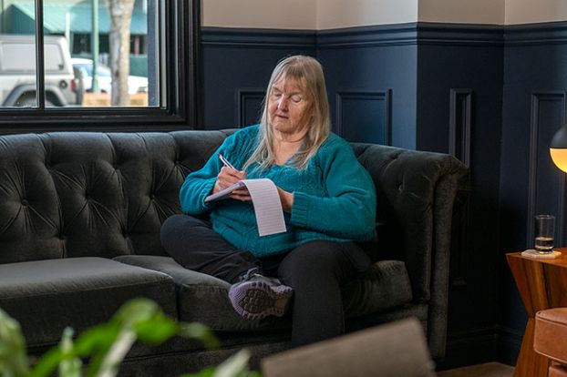 Rusty Rae/News-Register##Writer Starla Pointer in the lobby of the Atticus Hotel.