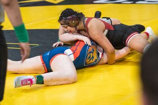Rusty Rae/News-Register##Dayton’s Aliyah Sauceda rolls Mysti Ferguson of Newport on her back in the consolation finals at the 4A/3A/2A/1A State tournament on Feb. 28. Sauceda fell in the semifinals, but battled through the consolation bracket to claim third place. Rusty Rae/News-Register##Dayton’s Aliyah Sauceda rolls Mysti Ferguson of Newport on her back in the consolation finals at the 4A/3A/2A/1A State tournament on Feb. 28. Sauceda fell in the semifinals, but battled through the consolation bracket to claim third place.