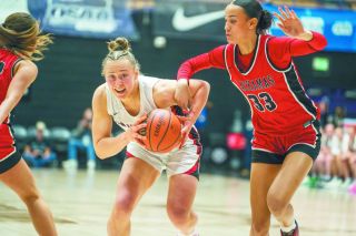 Rachel Thompson/News-Register##Senior wing Macie Arzner tries to find space to operate in the paint, being held back by Jazzy Davison, a Naismith High School All-American First Team selection.