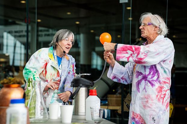 Rachel Thompson/News-Register##Carlton Observatory founder Janet Zuelke, left, and Bill Mackie, a retired physics professor from Linfield, demonstrate the laws of motion during the Science Fest